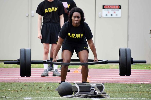 An Army staff sergeant completes a deadlift repetition during the U.S. Army Japan 2020 Army Week’s Army Combat Fitness Test Fitness Warrior Competition.