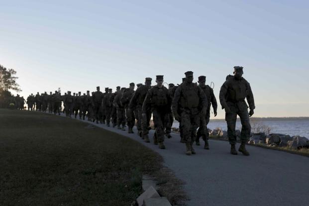 FILE -- Marines hike nine miles on Camp Lejeune, N.C., Dec. 9th, 2016.