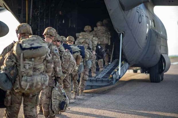 U.S. Soldiers board a Lockheed C-130 Hercules at K1 Air Base, Iraq,