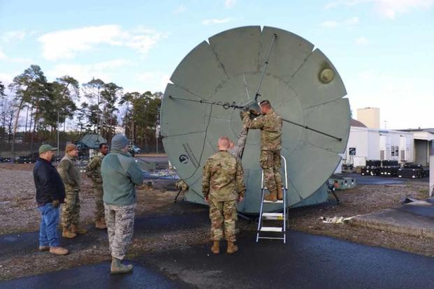 25th and 379th Space Range Squadrons build an antenna at Ramstein.