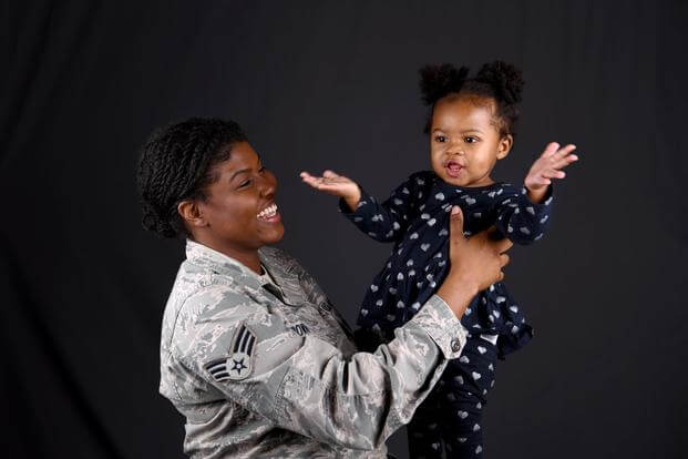 U.S. Air Force Senior Airman, Patrice Brown smiles at her daughter, Zoe on Nov. 14, 2018. 