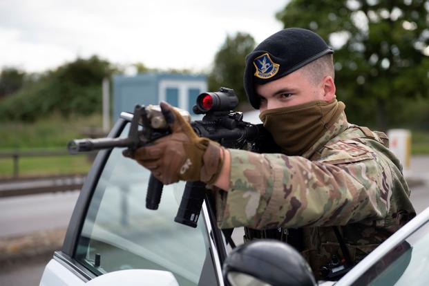 A 423rd Security Forces Squadron patrolman conducts a high-risk vehicle challenge during a training exercise at RAF Molesworth, England.