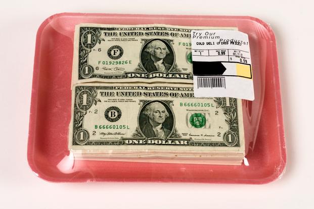 Supermarket meat tray full of $1 bills instead of meat