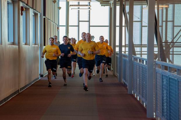Sailors run on the indoor track on Fort Carson. 