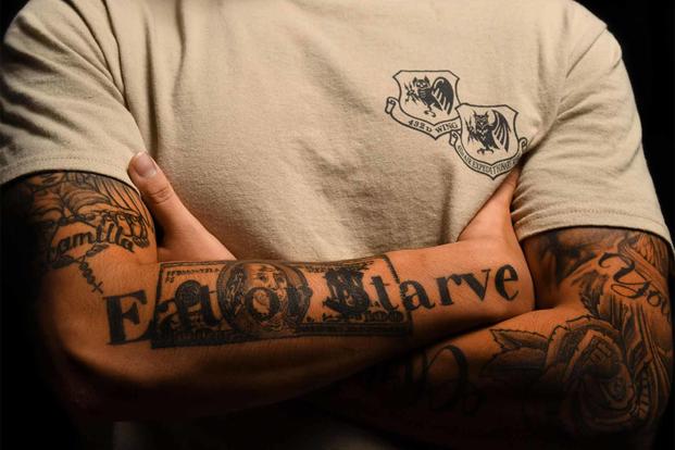 An airman displays his tattoos at Creech Air Force Base.
