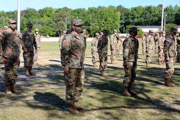 Soldiers at Fort Benning wear masks to protect against COVID-19.