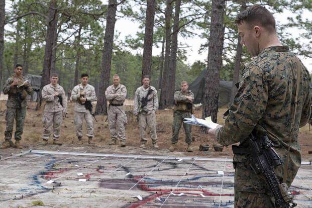 U.S. MariSimulated battalion level attack using a terrain model.