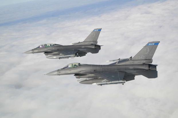 Two F-16 Fighting Falcon. fly in formation.