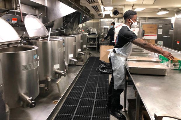 A culinary specialist prepares a meal in on of the carrier Gerald R. Ford's two galleys Nov. 17, 20202 (Hope Hodge Seck/Staff)