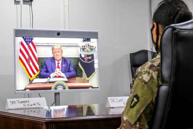 U.S. service members celebrate Thanksgiving with a call from President Donald Trump.
