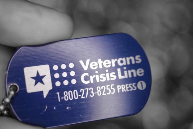 A photo illustration with the telephone number of the Veterans Crisis Line. (U.S. Air Force photo illustration by Zachary Hada)