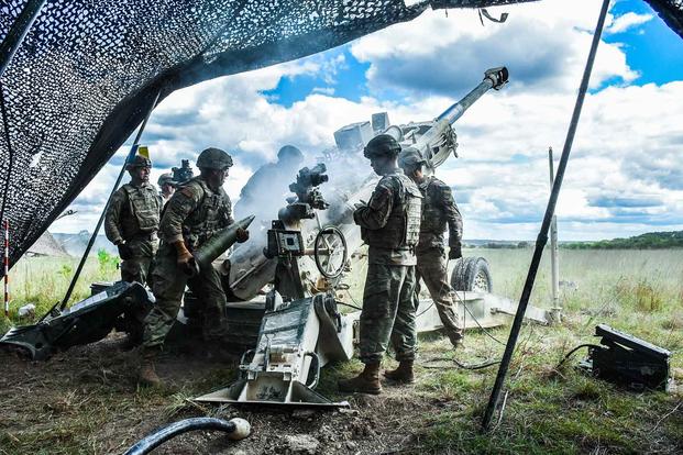 Members of the 3rd Cavalry Regiment load a howitzer as they train in preparation for a National Training Center rotation in 2019