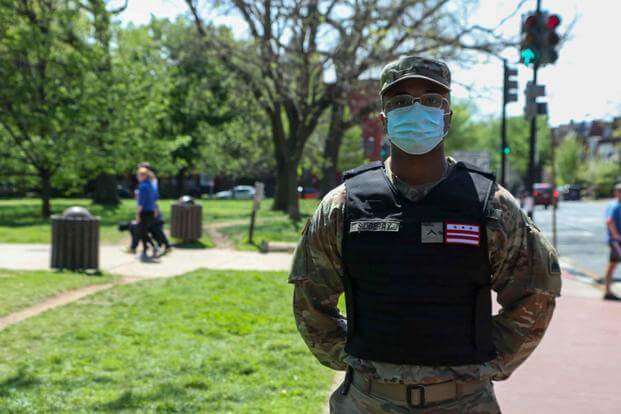 A member of the D.C. National Guard wearing  black identification vest. (District of Columbia National Guard)