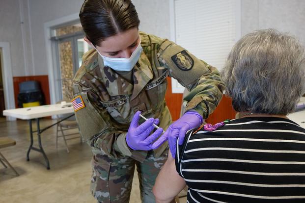 A Texas National Guard medic at a mobile COVID-19 vaccination event in Texas.