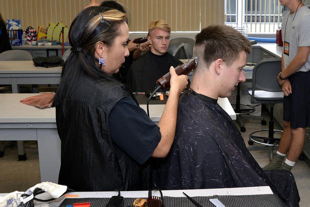 New Air Force cadet receives a haircut