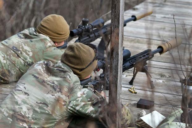 Paratroopers engage targets with bolt-action M2010 enhanced sniper rifles.