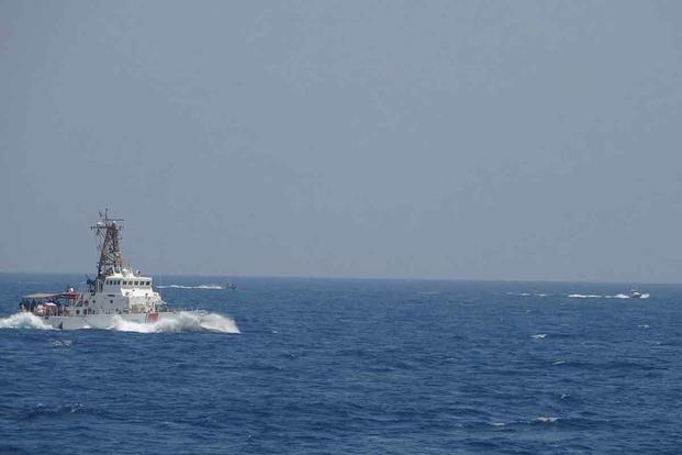 Iranian fast in-shore attack craft conduct maneuvers near USCGC Maui.