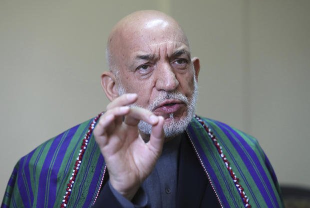 Former Afghan President Hamid Karzai speaks during an AP interview in Kabul, Afghanistan.
