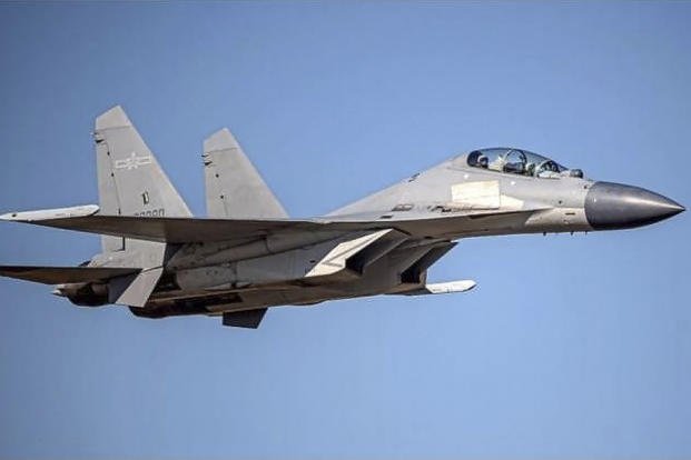 A Chinese PLA J-16 fighter jet flies at an undisclosed location.