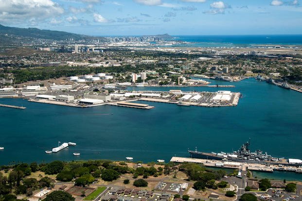 aerial view of the USS Arizona and USS Missouri Memorials at Ford Island, Joint Base Pearl Harbor-Hickam