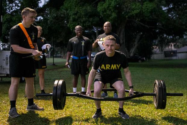 U.S. Army soldier attempts three repetition maximum deadlift event ACFT.