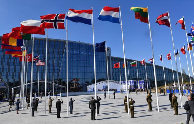 flags of NATO member countries flutter during a NATO summit in Brussels