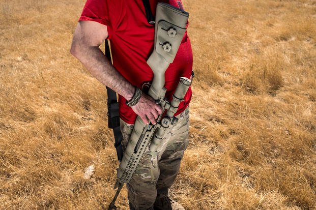 Firearms instructor Michael Palombo holds a Springfield Armory M25 rifle