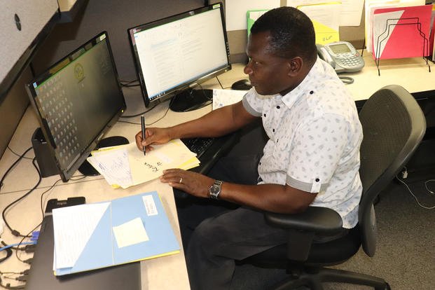 A contract specialist works a desk job at Fort McCoy.