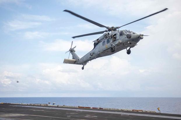 An MH-60S Sea Hawk prepares to land on USS Carl Vinson