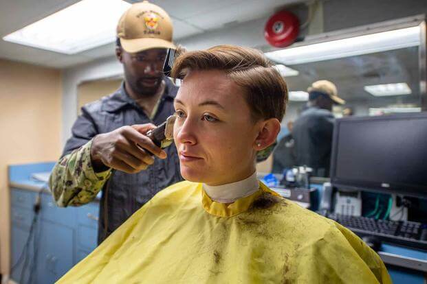 Saior receives a haircut in the barbershop aboard the USNS Mercy