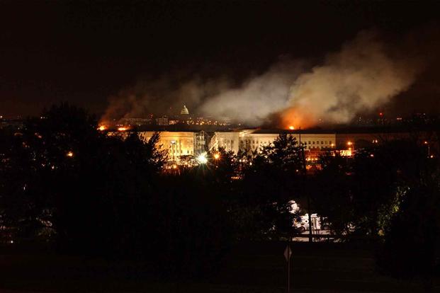 Smoke and flames in the aftermath of the 9/11 attack on the Pentagon