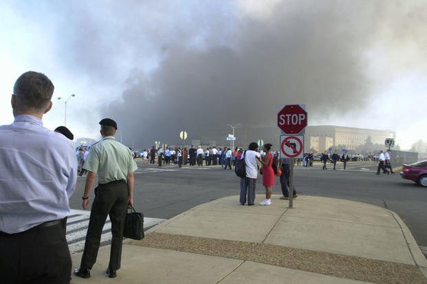 Pentagon employees gather in the South Parking Lot following the attack, 11 September 2001. (