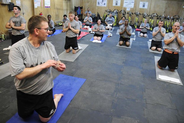 National Guardsman teaches a yoga class in Iraq.