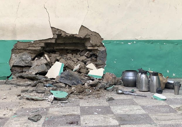 Damaged wall of a mosque is seen following a suicide bombers attack in the city of Kandahar.