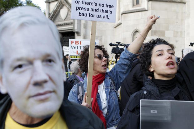 Julian Assange supporters demonstrate outside the High Court in London
