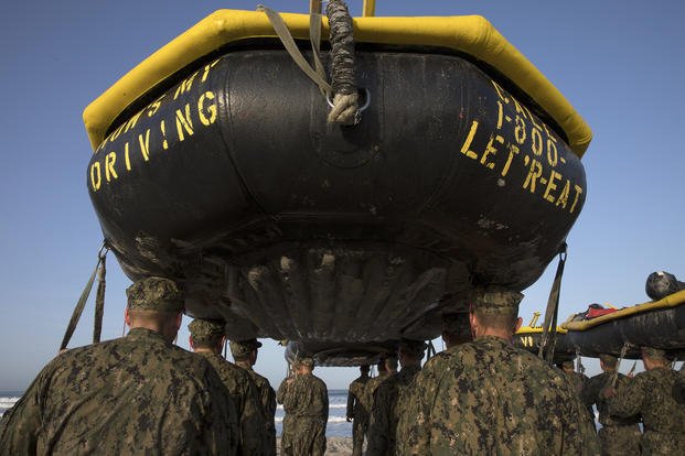 Navy SEAL candidates participate in Basic Underwater Demolition/SEAL training.