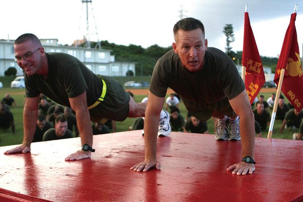 Marines perform push-ups.