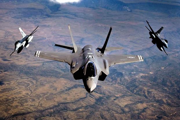 An F-35 Lightning II and two F-16 Fighting Falcons