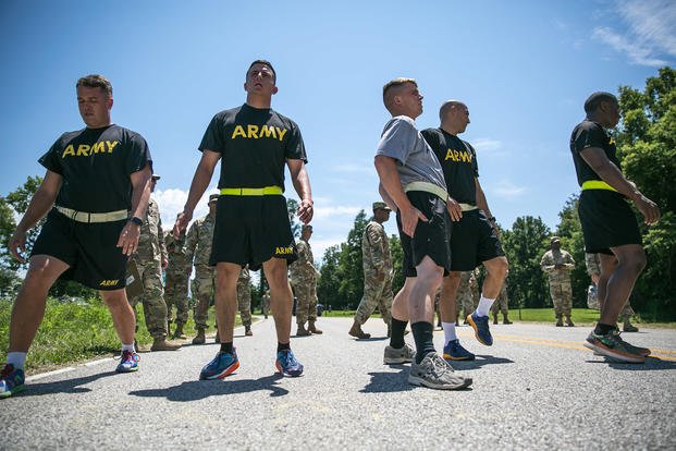 Soldiers stretch before running as part of the Army physical fitness test.