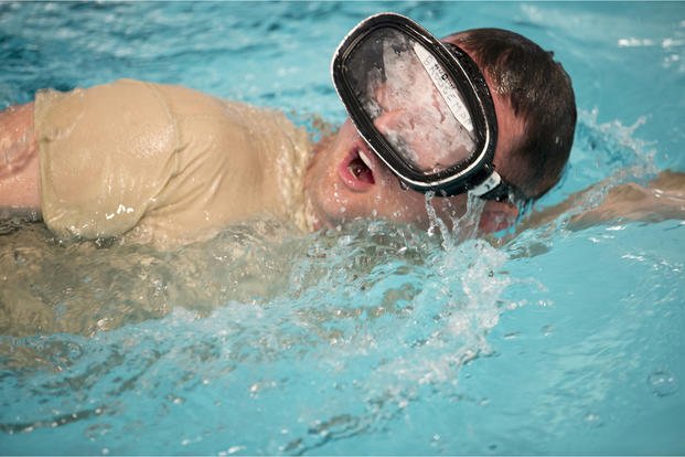 A Special Ops recruiter swims during a workout. 