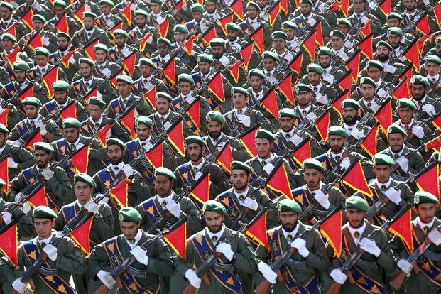 Iran’s Revolutionary Guard troops march in a military parade