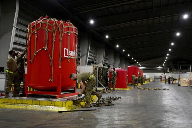 Airmen palletize water filtration systems destined for Red Hill, Hawaii