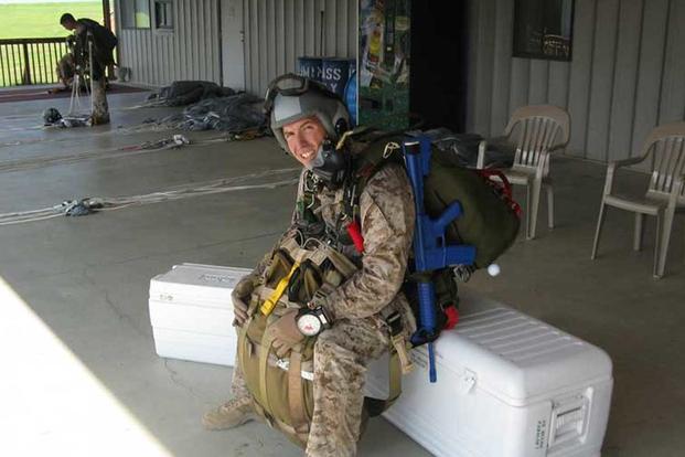 Joshua Plummer waits to board an aircraft for a combat equipment training jump