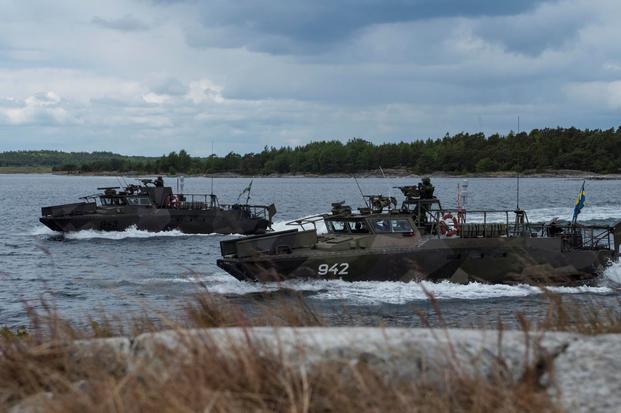 Swedish Marines  prepare to come ashore.