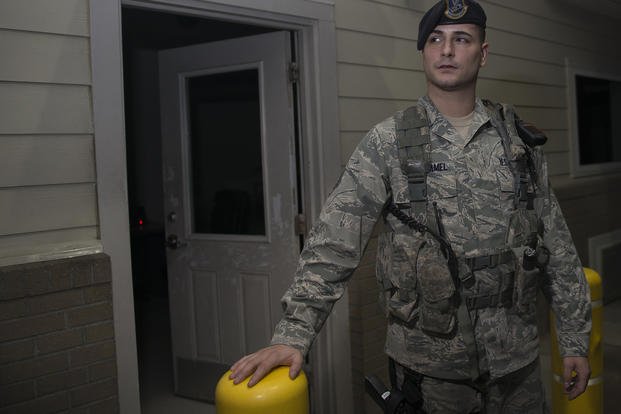 An airman stands guard during the night shift.