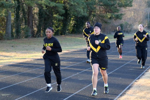 Soldiers conduct the two-mile run portion of the unit’s Army physical fitness test.