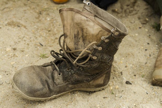A soldier's boot is shown after an eight-mile ruck march.