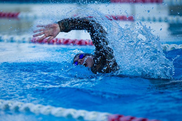 A Marine conducts the 1,400-meter swim event during a squad competition in Okinawa, Japan.