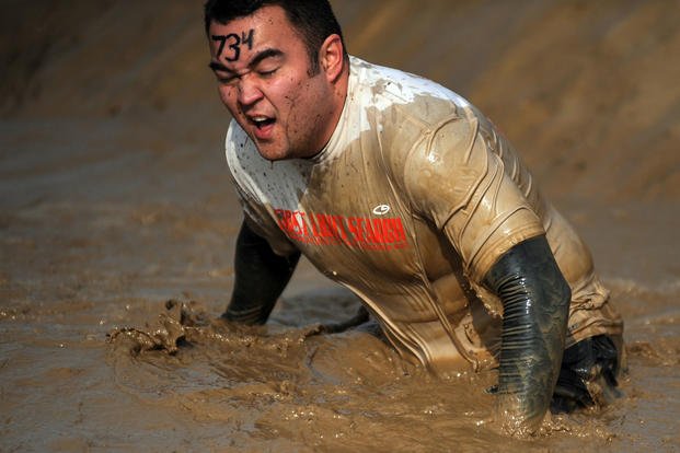 A petty officer competes in a Tough Mudder event. 
