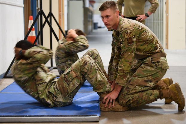 Airmen practice sit-ups for the Global Strike Challenge.